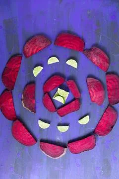 Beetroot in the form of a pattern with lemon slices on a vintage background Stock Photos