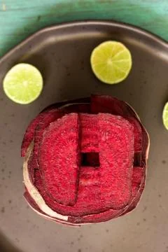 Beetroot in the form of a pattern with lemon slices on a vintage background Stock Photos