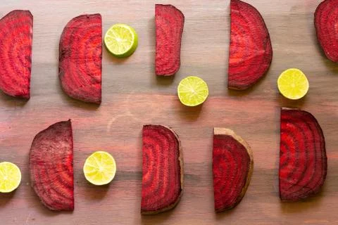 Beetroot in the form of a pattern with lemon slices on a vintage background Stock Photos