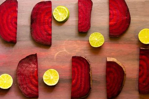 Beetroot in the form of a pattern with lemon slices on a vintage background Stock Photos