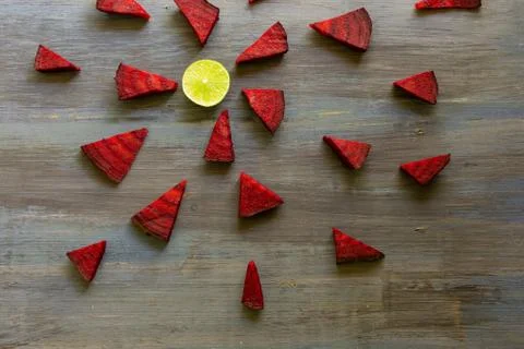Beetroot in the form of a pattern with lemon slices on a vintage background Stock Photos