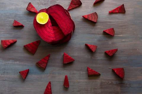 Beetroot in the form of a pattern with lemon slices on a vintage background Stock Photos