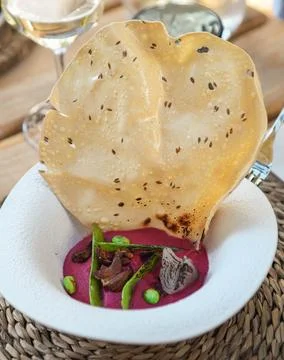 Beetroot hummus with crispy corn tortilla Stock Photos