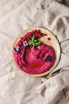 Beetroot hummus spread with nuts Stock Photos