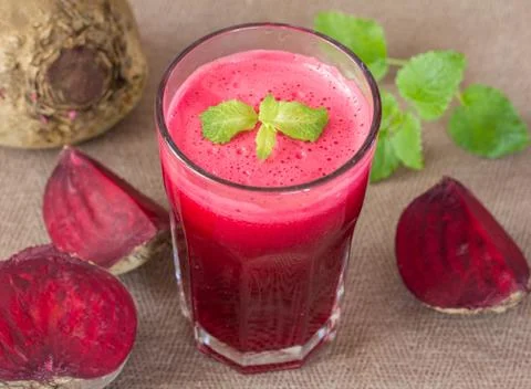 Beetroot juice in glass and beetroot vegetables Stock Photos