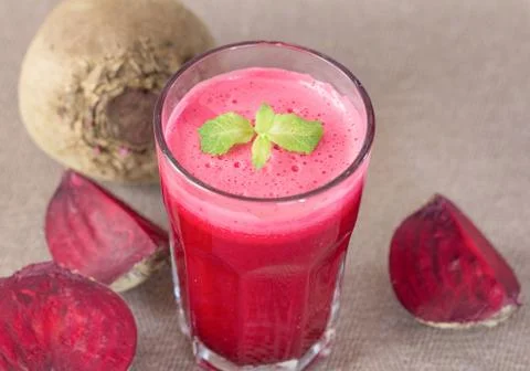 Beetroot juice in glass with beetroot vegetables Stock Photos