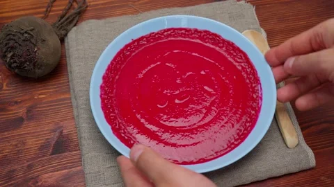 Beetroot Puree Soup on a wooden background top view. Healthy homemade soap. Copy Stock Footage 214401759