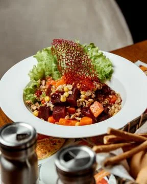 Beetroot salad with carrots, corn and nuts Stock Photos