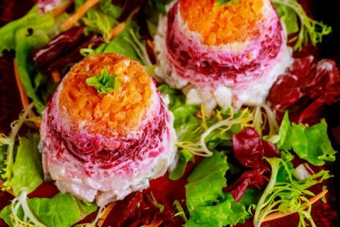 Beetroot salad with herring and vegetable. Stock Photos