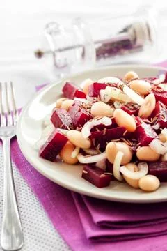 Beetroot salad with white kidney beans, pickles and onion Stock Photos