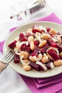 Beetroot salad with white kidney beans, pickles and onion Stock Photos