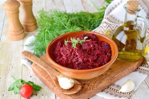 Beetroot saute with onions and tomatoes garlic and olive oil in a brown bowl Stock Photos
