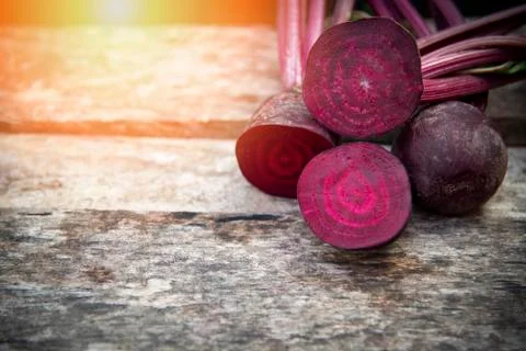 Beetroot slice / Fresh red beet roots on wooden background Stock Photos