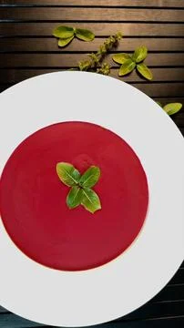 Beetroot soup on black background reflects eco-luxury dining, showcasing organic Stock Photos