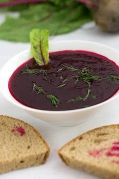 Beetroot soup garnished with dill Stock Photos