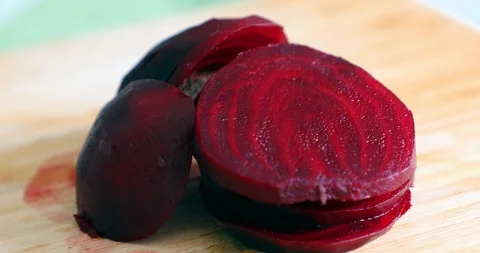 Beetroot vegetable being cut on circles pieces with knife Stock Footage 88316216