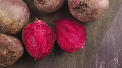Beetroots are cut and placed on a wooden table Stock Footage 340063050