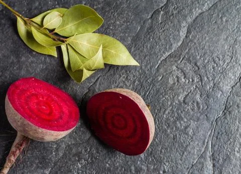 Beets cut on a black stone background Stock Photos