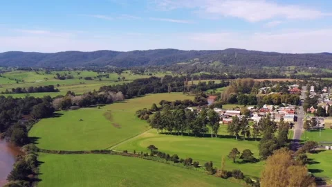 Bega river flowing around Bega town in agriculture valley of Australia air 4k. Stock Footage 196807474