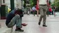 Beggar and people on the street in Athens, Greece HD Footage