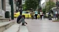 Beggar and people on the street in Athens, Greece HD Footage