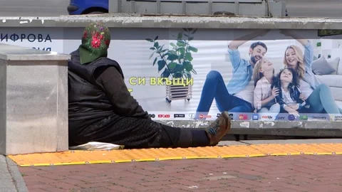 Beggar Asks For Money, Against the Background of a Happy Family, Life Stock Footage 130182560