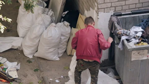 Beggar Homeless Man Digs In A Garbage Garbage Bag Stock Footage 163638019