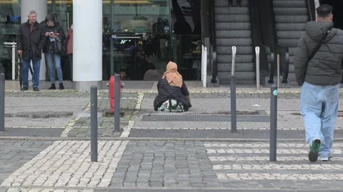 Beggar outside Vasco da Gama shopping centre in Lisbon, Portugal Video stock 328485326
