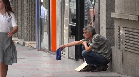 Beggar on sidewalk in Alicante Stock Footage 44346655