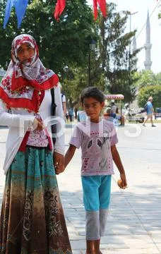 Beggar Woman and Daughter outside Blue Mosque in Istanbul, Turkey Stock Photos