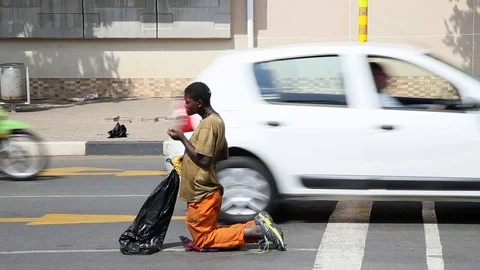Begging in traffic Stock Footage 99074093