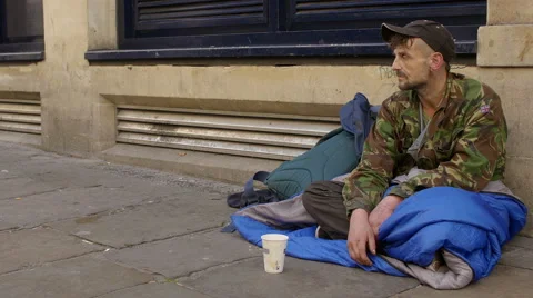 Begging young man in the street  Stock Footage 56969397