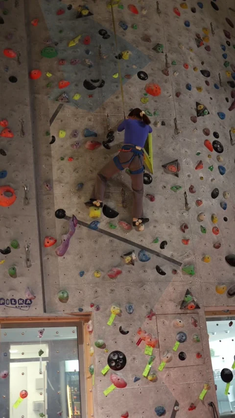 Beginner climber improves technique during indoor training Stock Footage 339287649