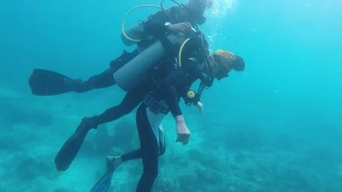 Beginner Diver got up on sea by coach video taken by gopro Stock-Footage 136596917