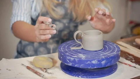 Beginner doing pottery in a class. Stock Footage 110932875