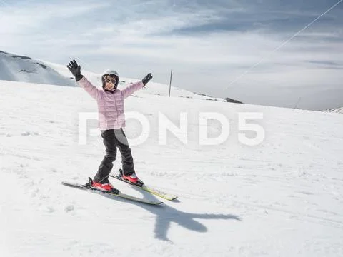 Beginner little girl learning to ski Stock Photos