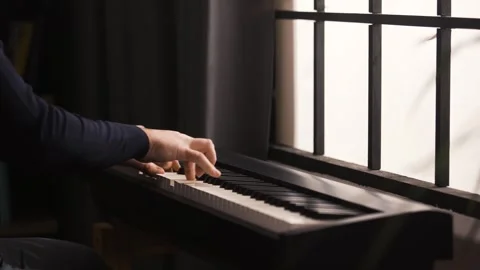 Beginner Pianist Practicing on Electronic Piano Keyboard at Home Stock Footage 342237477