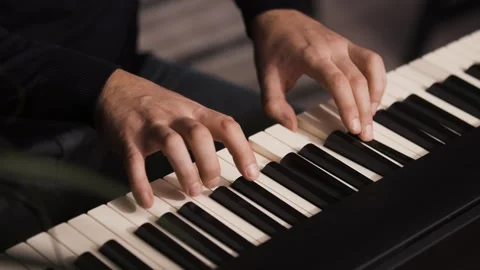 Beginner Pianist Practicing on Electronic Piano Keyboard at Home Stock Footage 342237533