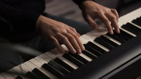 Beginner pianist practicing on a electronic piano keyboard at home Video stock 342237558