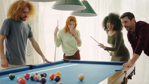 Beginner player hitting a billiard ball and laughing happy Video stock 273196036