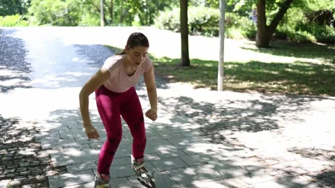 Beginner skater struggles to ride backward making funny mistakes in the park Video stock 342267774