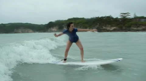 Beginner surfer girl Stock Footage 11845030