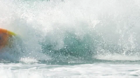 Beginner surfer rides the wave and falls | Stock Video | Pond5