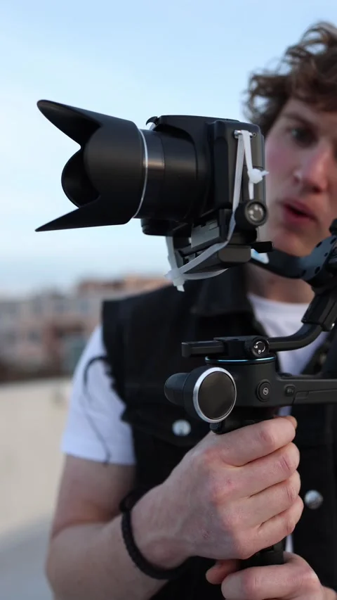 Beginner using camera stabilizer Stock Footage 332116786