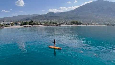 Beginner Woman Practicing SUP in Kalamata, Greece Stock Footage 335801661