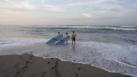 Beginners going to learn to surf Stock Footage 126030853