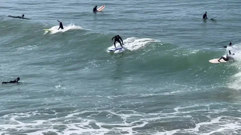 Beginners learn surfing at Atlantic Ocean in Morocco, Agadir Stock Footage 248666371