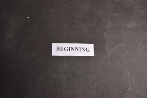 Beginning concept paper note on black textured background with minimalist d.. Stock Photos