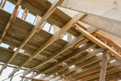 The beginning of the construction of the triangular cottage. House frame buil Stock Photos