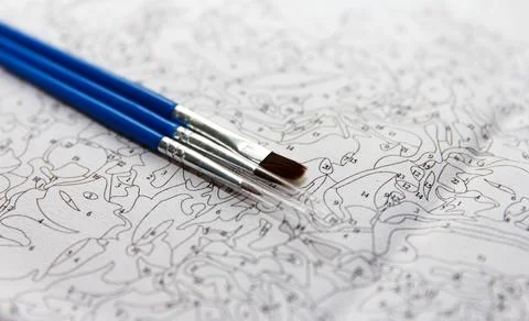 The beginning of the creative process of painting a picture with multicolored Stock Photos